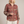 Lucille floral V neck blouse in Brick Red on a light gray studio backdrop