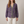 Lucille floral V neck blouse in Purple on a light gray studio backdrop
