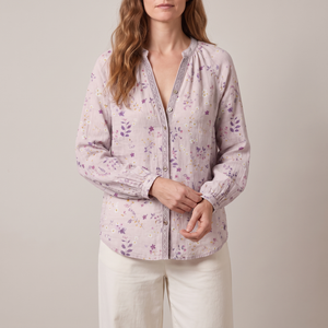 Lucille floral V neck blouse in Pink on a light gray studio backdrop