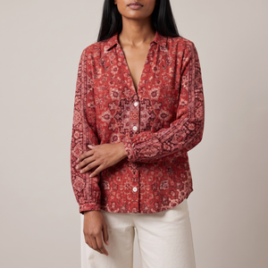 Lucille floral V neck blouse in Red on a light gray studio backdrop