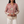 Lucille floral V neck blouse in Rose on a light gray studio backdrop