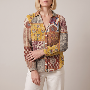 Lucille floral V neck blouse in Yellow Patchwork on a light gray studio backdrop