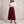 Margot pleated maxi skirt in Burgundy on a light gray studio backdrop