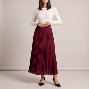 Margot pleated maxi skirt in Burgundy on a light gray studio backdrop