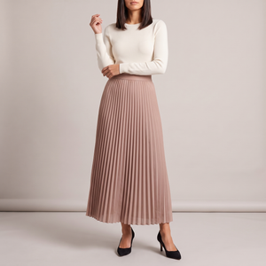 Margot pleated maxi skirt in Dusty Rose on a light gray studio backdrop