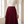 Front view of the elastic high waistband and fine pleats of the Margot skirt in Burgundy