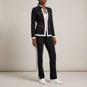 Marianne tracksuit set in Black on a light gray studio backdrop