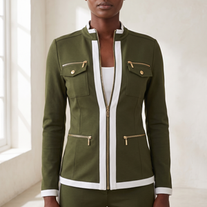 Close view of the Marianne tracksuit set jacket in Olive showing the chest pockets and white trim