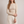 Maribel long sleeve crop top in Beige on a light gray studio backdrop