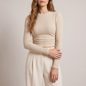 Maribel long sleeve crop top in Beige on a light gray studio backdrop