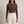 Maribel long sleeve crop top in Brown on a light gray studio backdrop