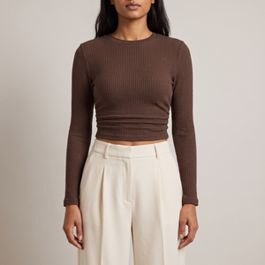Maribel long sleeve crop top in Brown on a light gray studio backdrop