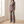 Marion plaid pantsuit worn by a window in a bright room