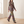 Marion plaid pantsuit worn walking across a pale oak floor
