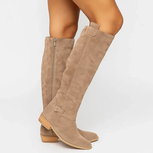 Marlene knee high suede boots in Beige with a wood tone block heel, side view of the inside zip
