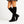 Marlene knee high suede boots in Black with a black block heel, worn with a floral skirt