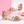 Martina low block heel sandals in Rose Gold on a display step