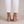 Martina low block heel sandals in Rose Gold seen from behind on a light gray studio backdrop