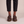Matilda leather Mary Jane flats in Brown seen from the front on a light gray studio backdrop