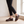 Matilda Mary Jane flats in Brown mid step by a window on a pale oak floor