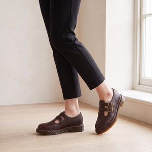 Matilda Mary Jane flats in Brown mid step by a window on a pale oak floor