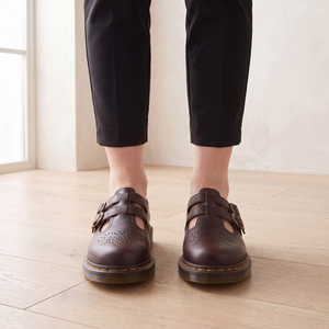 Front view of the Matilda Mary Jane flats in Brown showing the heart perforations and buckle straps