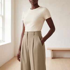 Close view of the Khaki Nadine pants high waistband, belt loops, front pleats and side pocket