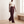 Woman walking in Burgundy Nadine wide leg pants that fall to the floor