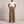Nadine wide leg pants in Light Brown on a light gray studio backdrop