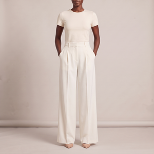 Nadine wide leg pants in White on a light gray studio backdrop