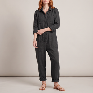 Nerea linen blend jumpsuit in Black on a light gray studio backdrop