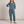 Nerea linen blend jumpsuit in Blue on a light gray studio backdrop