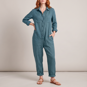 Nerea linen blend jumpsuit in Blue on a light gray studio backdrop