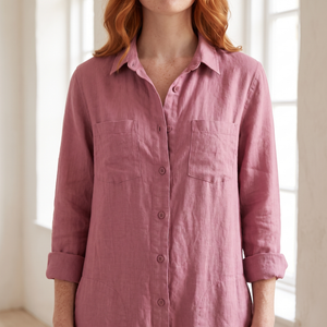Close view of the Nerea jumpsuit in Pink showing the shirt collar, button front and chest pockets