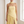Close view of the Ondine gown bodice, asymmetric hem and matching scarf in Yellow