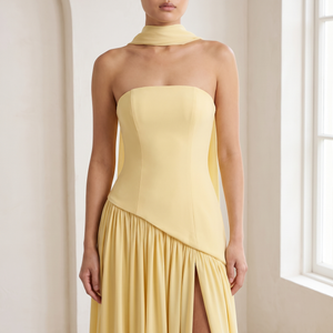 Close view of the Ondine gown bodice, asymmetric hem and matching scarf in Yellow