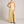 Ondine strapless maxi gown in Yellow on a light gray studio backdrop