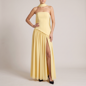 Ondine strapless maxi gown in Yellow on a light gray studio backdrop