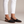 Ornella woven slingback flats in Black on a light gray studio backdrop