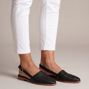Ornella woven slingback flats in Black on a light gray studio backdrop