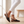 Side view of the Black Ornella flat showing the slingback strap and buckle