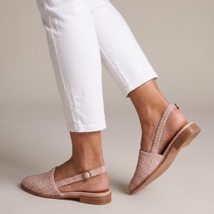 Ornella woven slingback flats in Light Pink on a light gray studio backdrop