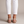 Ornella woven slingback flats in White on a light gray studio backdrop