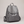 Pauline leather backpack in Gray standing upright on a light gray studio backdrop