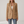 Perrine single button blazer in Camel on a light gray studio backdrop