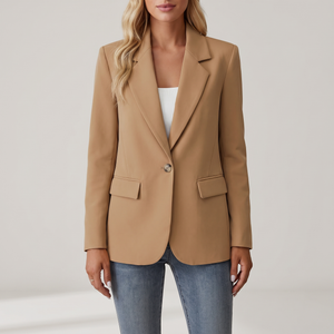 Perrine single button blazer in Camel on a light gray studio backdrop