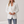 Perrine single button blazer in White on a light gray studio backdrop