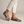 Portia leopard print loafers with gold horsebit on a light gray studio backdrop