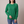 Rita raglan crew neck sweatshirt in Green on a light gray studio backdrop