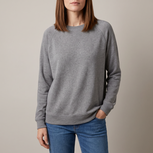 Rita raglan crew neck sweatshirt in Gray on a light gray studio backdrop